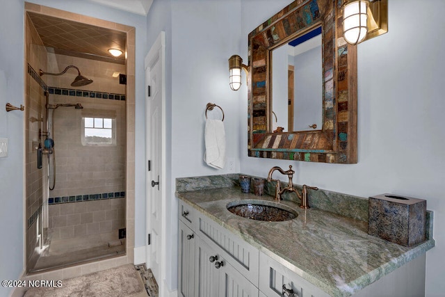 bathroom featuring large vanity and an enclosed shower