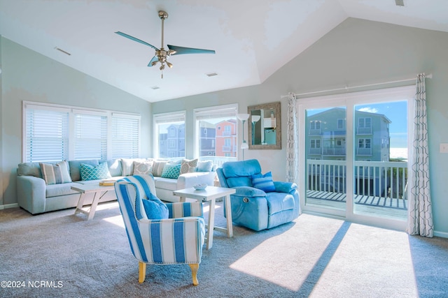 carpeted living room featuring ceiling fan and vaulted ceiling