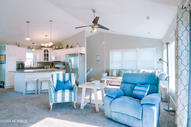 living room with light carpet, high vaulted ceiling, ceiling fan, and sink