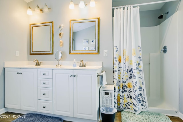 bathroom featuring a shower with curtain and vanity