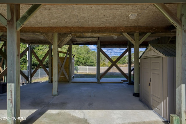 view of patio featuring a storage unit