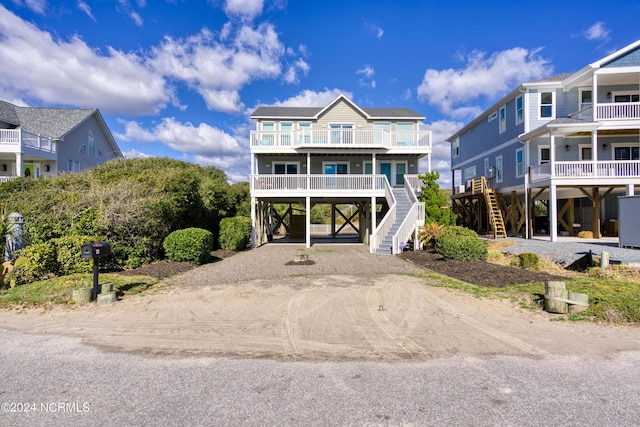 coastal inspired home featuring a carport