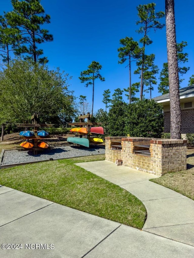 view of community with exterior kitchen