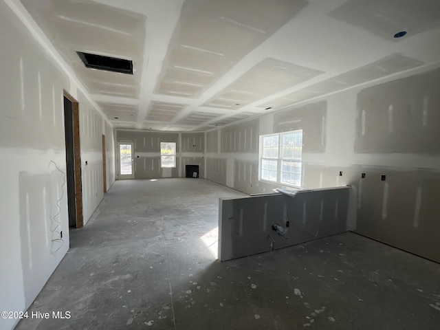 unfurnished room with a healthy amount of sunlight and visible vents