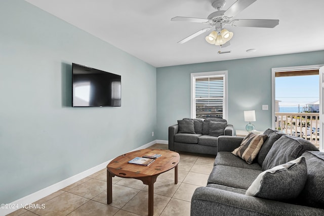 tiled living room featuring ceiling fan