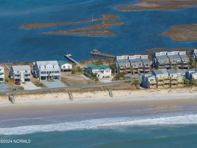 bird's eye view featuring a view of the beach and a water view