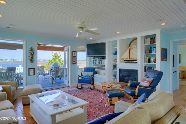 living room featuring wooden ceiling, light tile patterned floors, ceiling fan, and built in features