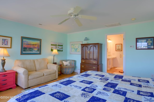 bedroom featuring ornamental molding, light hardwood / wood-style floors, ceiling fan, and ensuite bathroom