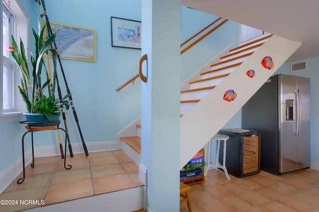 staircase with tile patterned flooring