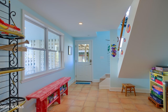 entrance foyer with light tile patterned flooring