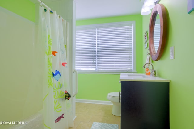 bathroom featuring a shower with curtain, vanity, toilet, and tile patterned floors