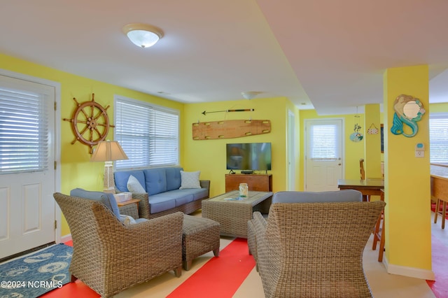 living room with a wealth of natural light and carpet floors