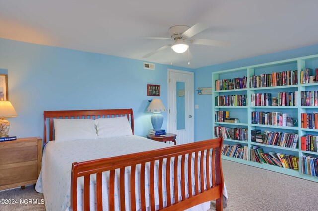 bedroom with ceiling fan and carpet flooring