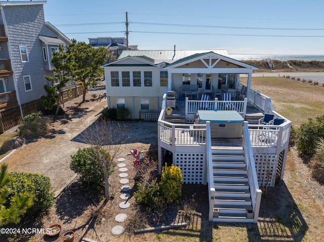 rear view of house with a wooden deck