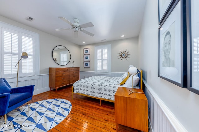 bedroom with hardwood / wood-style floors and ceiling fan