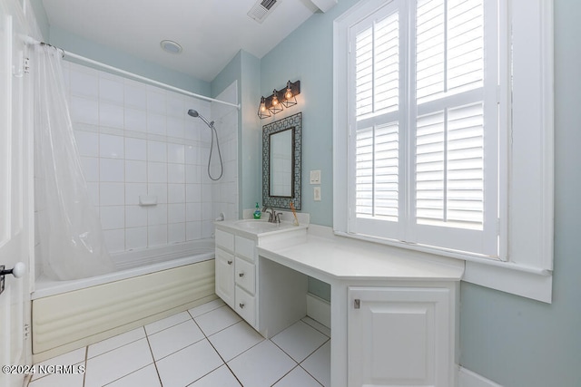 bathroom featuring vanity, shower / bath combo with shower curtain, and tile patterned floors