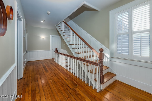 stairs featuring hardwood / wood-style flooring