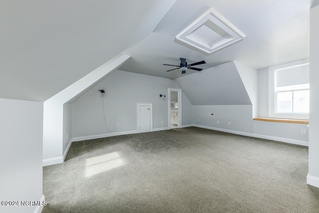 additional living space with ceiling fan, lofted ceiling, and carpet