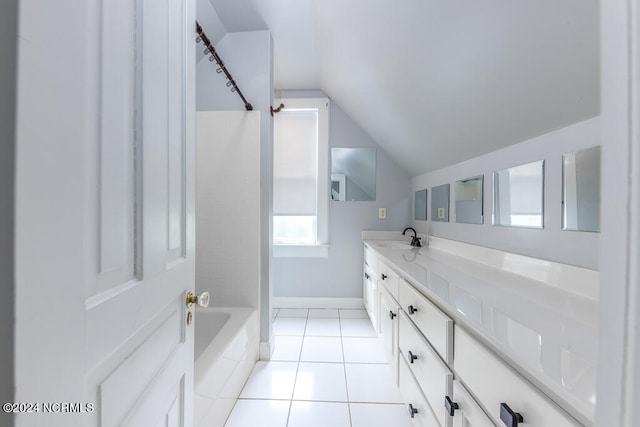 bathroom featuring washtub / shower combination, tile patterned flooring, vanity, and vaulted ceiling