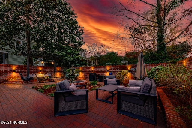 patio terrace at dusk with a pergola and an outdoor hangout area