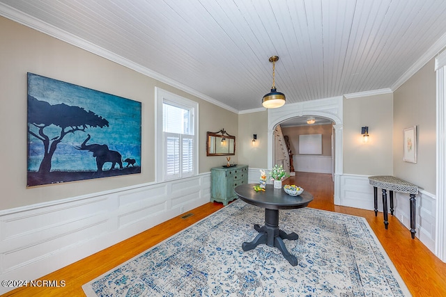 interior space with wood-type flooring, crown molding, and wooden ceiling