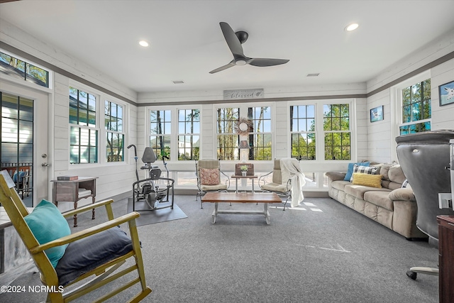 sunroom with ceiling fan and a wealth of natural light