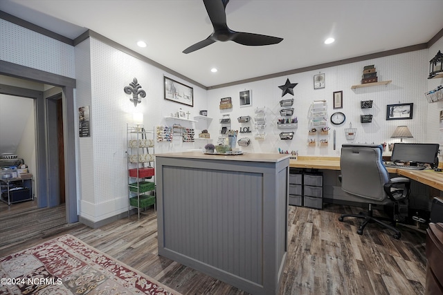 office space featuring ornamental molding, dark hardwood / wood-style flooring, ceiling fan, and built in desk