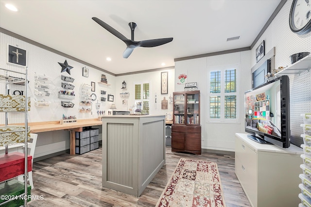 kitchen with ornamental molding, gray cabinets, ceiling fan, and light hardwood / wood-style flooring