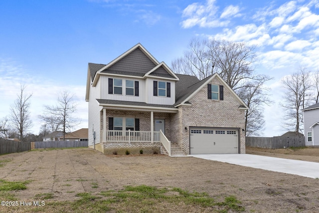 view of front facade with fence, brick siding, covered porch, and driveway