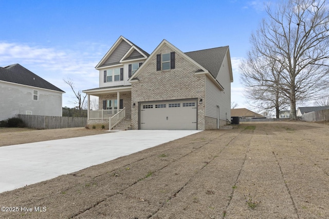 view of front of property featuring brick siding, fence, concrete driveway, covered porch, and a garage