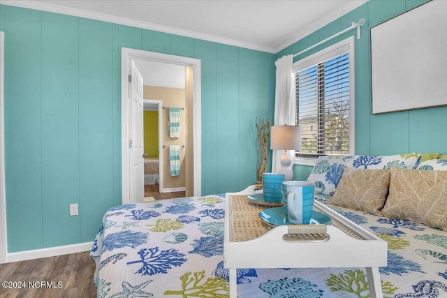 bedroom featuring hardwood / wood-style flooring and ornamental molding