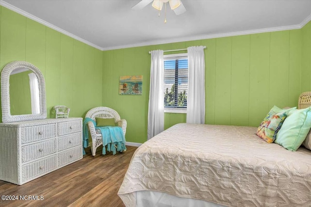 bedroom with ceiling fan, ornamental molding, and dark hardwood / wood-style floors