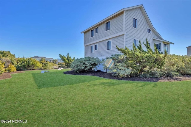 view of property exterior featuring a yard