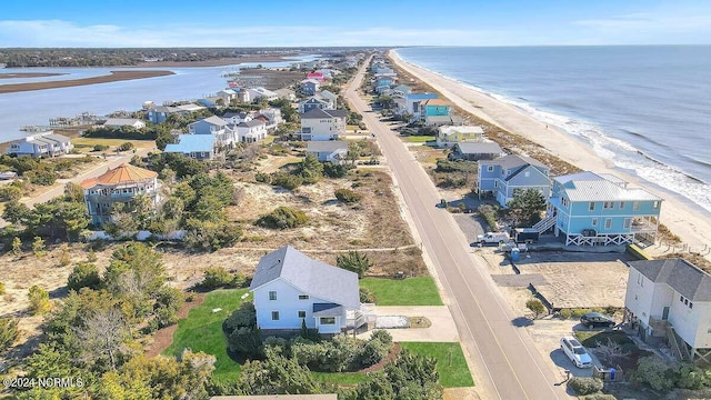 aerial view with a water view and a view of the beach