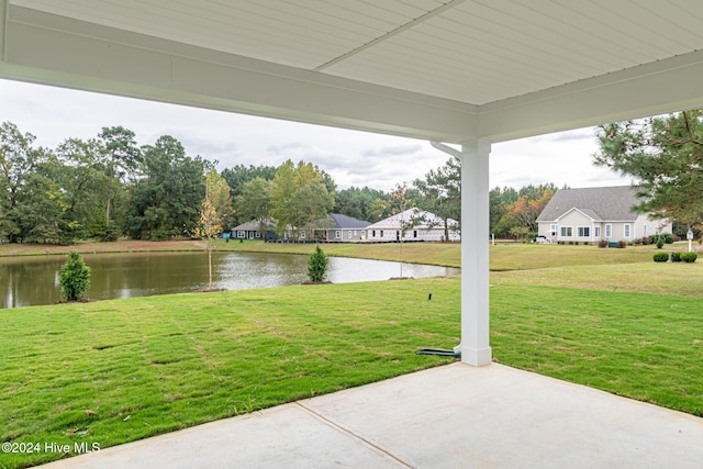 exterior space with a patio area and a water view