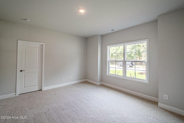 unfurnished room with carpet floors