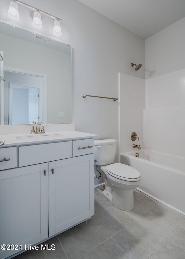 full bathroom featuring tile patterned flooring, vanity, toilet, and washtub / shower combination