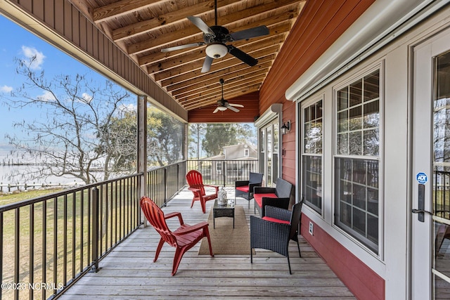 wooden terrace featuring ceiling fan