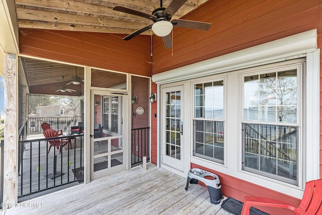 wooden deck featuring ceiling fan and french doors