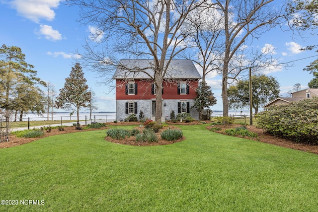 back of house featuring a lawn