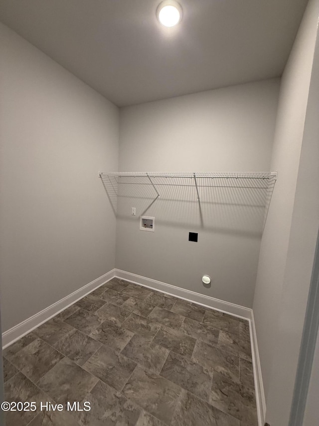 clothes washing area featuring laundry area, washer hookup, and baseboards