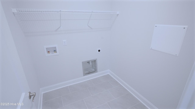 clothes washing area featuring hookup for a washing machine, hookup for an electric dryer, tile patterned flooring, laundry area, and baseboards