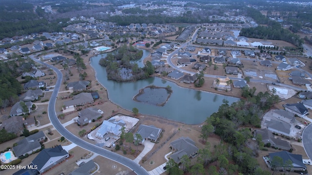 drone / aerial view featuring a water view and a residential view