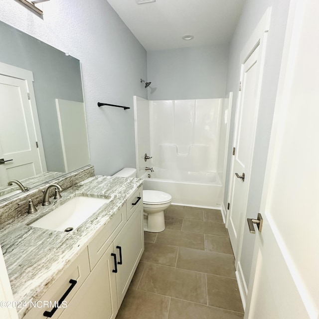 full bathroom featuring vanity, toilet, tile patterned floors, and shower / tub combination