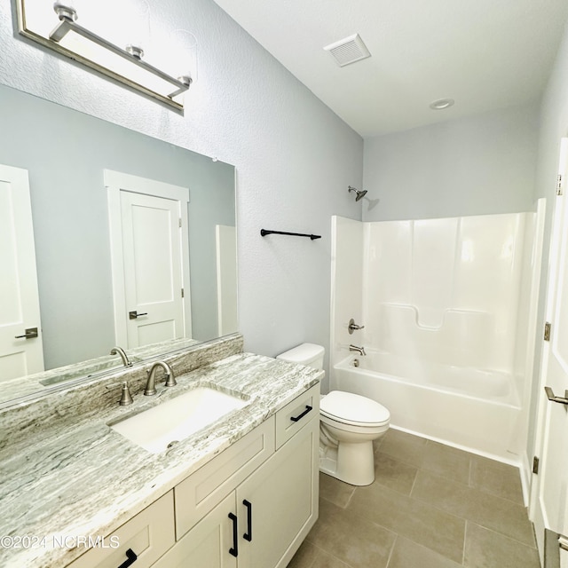 full bathroom with tile patterned floors, shower / bath combination, toilet, and vanity