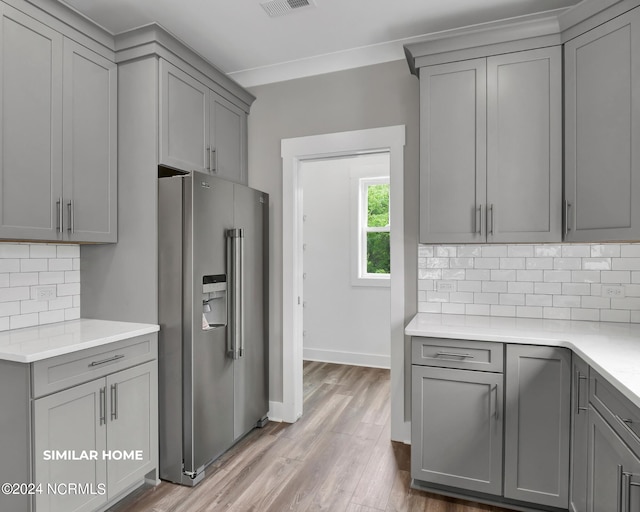 kitchen with gray cabinets, light countertops, and high quality fridge