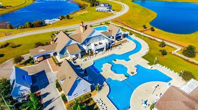 birds eye view of property featuring a water view