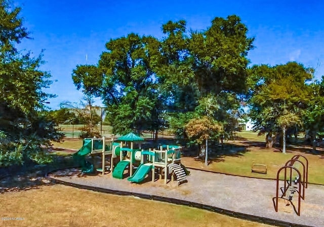 community jungle gym with a yard