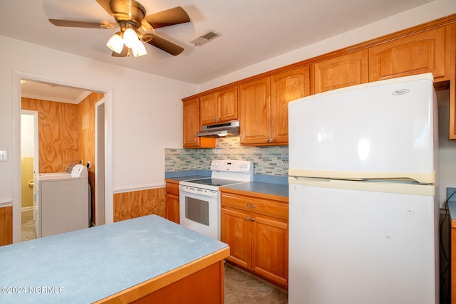 kitchen featuring light tile flooring, ceiling fan, washing machine and clothes dryer, white appliances, and backsplash