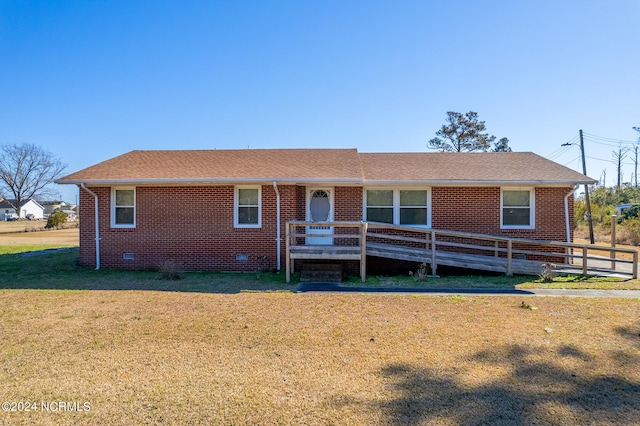 ranch-style house featuring a front lawn